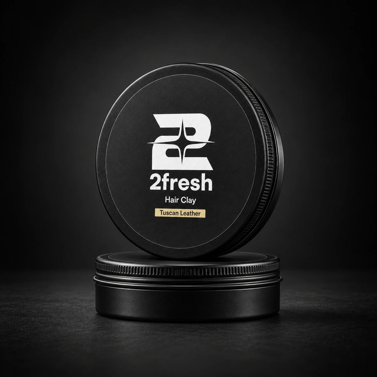 Two closed 2fresh Hair Clay tins arranged in a stack