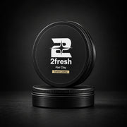 Two closed 2fresh Hair Clay tins arranged in a stack