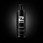 A tall black pump bottle of 2fresh Shampoo centered on a dark gradient background with a spotlight effect.