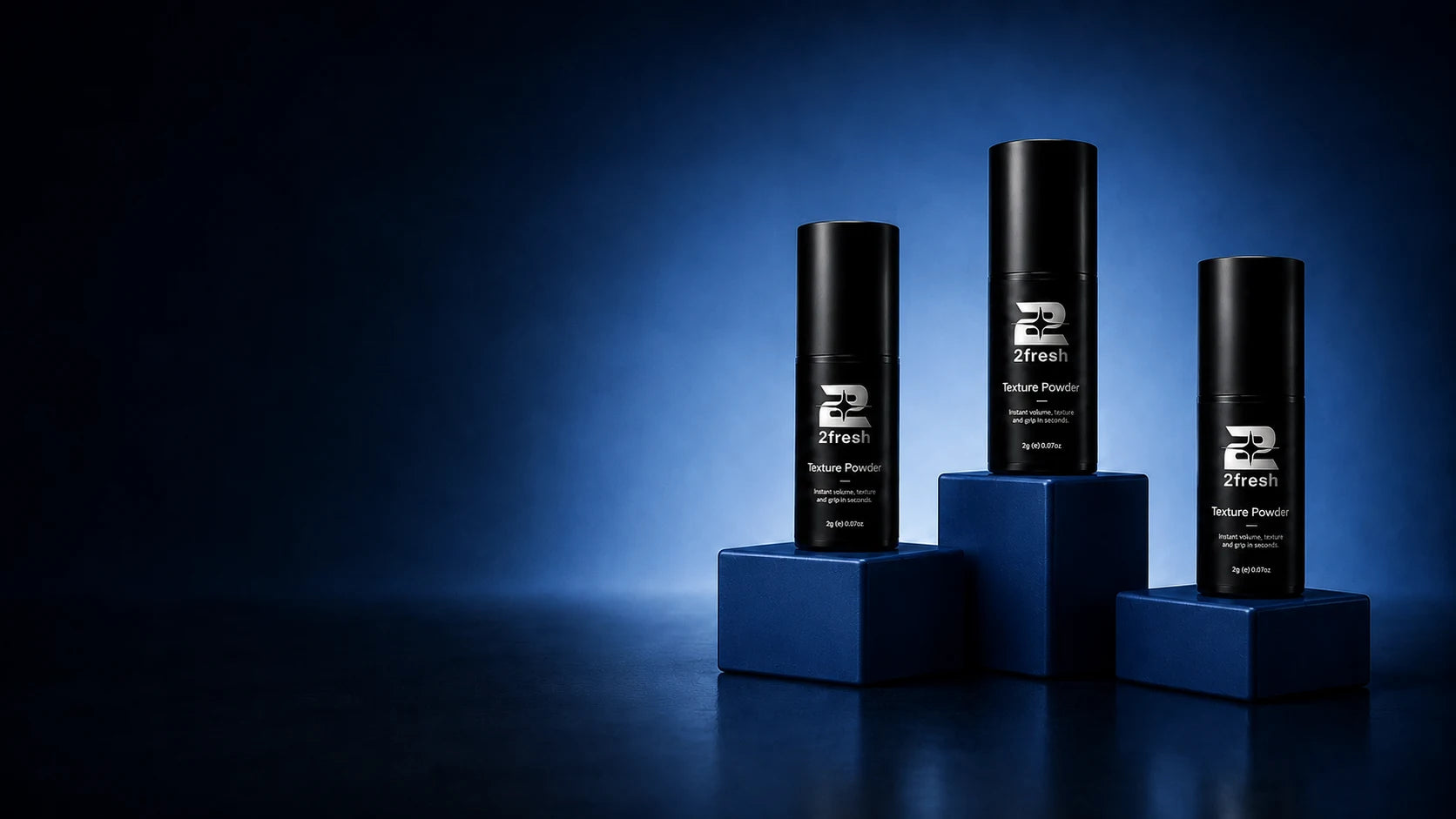 Three 2Fresh Texture Powder bottles on navy display blocks